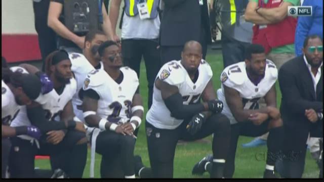 Jaguars players lock arms, some kneel, during National Anthem prior to London game against Ravens